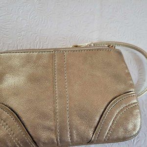 SOLD  Gold Coach wristlet in excellent shape